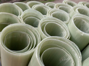 Corrugated plastic tree guards bundled together.