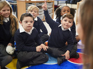 Primary school children with Special Educational Needs being taught in class.
