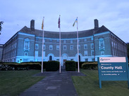 County Hall lit up in blue lighting for Carers Week.