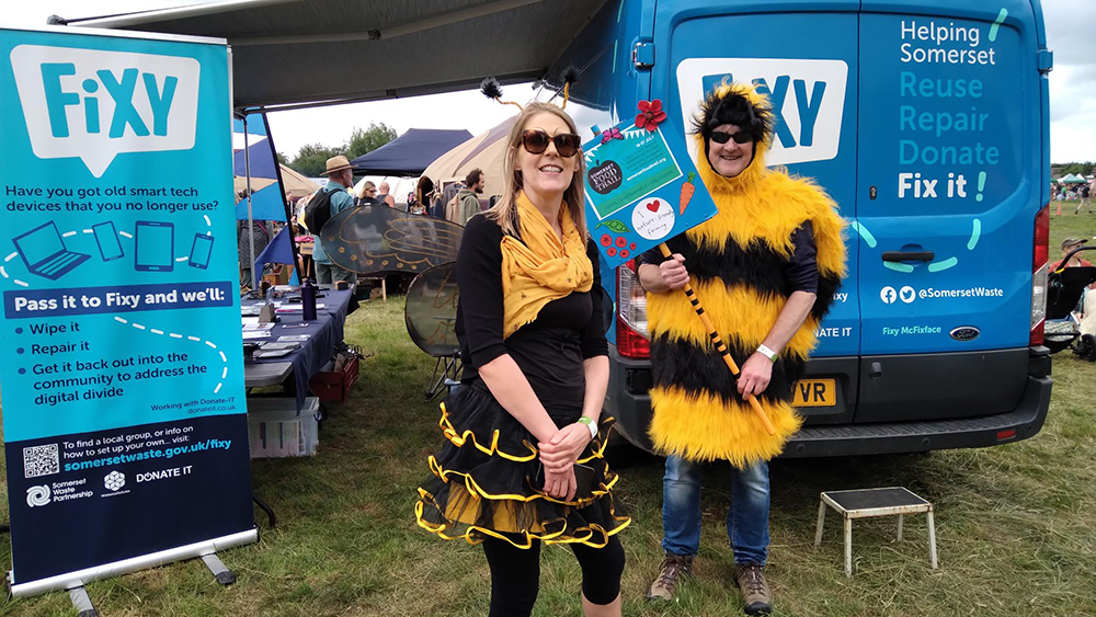 Fixy staff dressed in bumble bee costumes at the Green Scythe Fair.