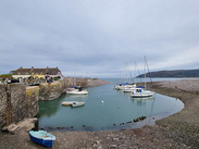 A scenic image of the harbour at Porlock Weir.