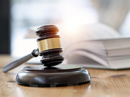 Wooden brown judge gavel on the table.