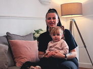 Leanne sitting down with baby daughter Bonnie on her lap.