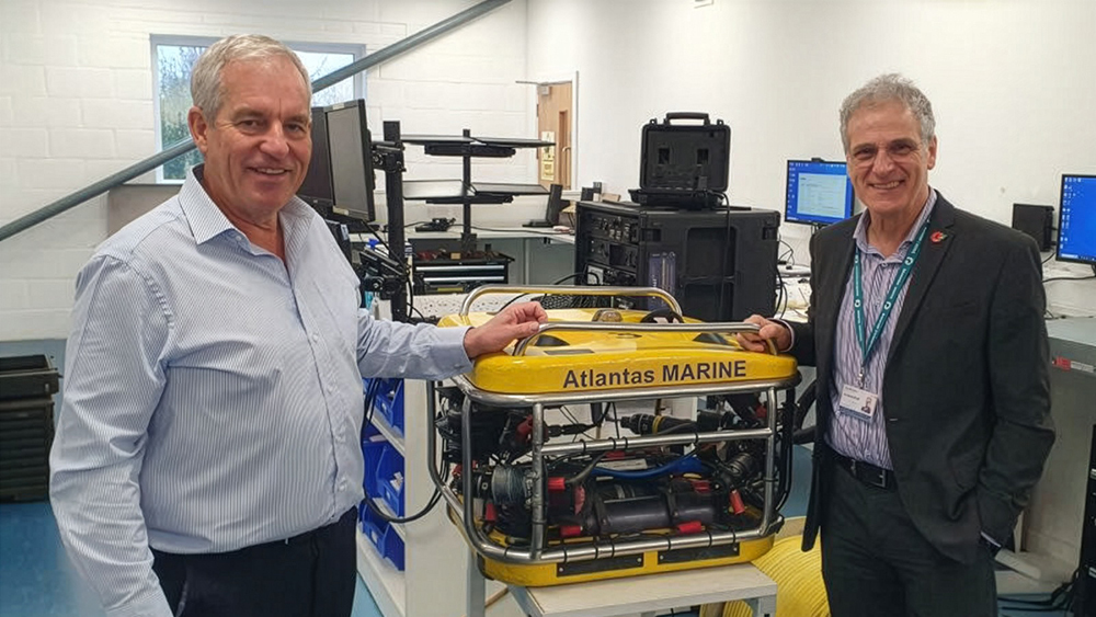 Charlie Foll and Cllr David Woan stand beside an Atlantas Marine remotely operated vehicle at the company’s Yeovil HQ.