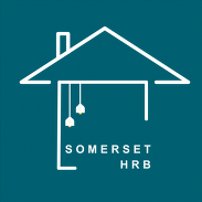 Somerset Housing Reduction Board logo showing a white house outline with two hanging lights on a teal background.