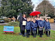 Knights Templar pupils try out their weatherproofs with Head Laura Weaver & Fiona Payne from Watchet Visitor Centre by Isobel Pring.