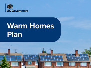 Front cover of the Government's Warm Homes Plan showing suburban houses with solar panels under a blue sky.