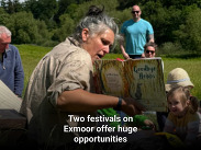 A storyteller reads “Goodbye Hobbs” to a small group outdoors in a sunny field at an Exmoor festival.