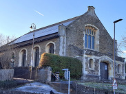 The Lucky Chance building with solar panels on its roof, showing the former church now refurbished as a sustainable cultural venue.
