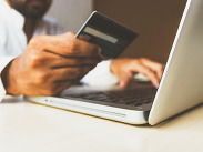 Person holding a credit card while using a laptop for online payment or shopping, by Free stock photos from www.rupixen.com from Pixabay