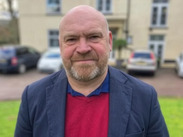 Leader of Somerset Council, Cllr Bill Revans, standing in front of County Hall, Taunton.