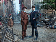 Fiennes Tiffin and Donal Finn on location for Young Sherlock, standing in a Victorian street scene filmed in Shepton Mallet.