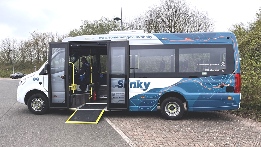 New Slinky bus with accessible ramp at the door, showing digital branding and low‑floor access for passengers in Taunton and Wellington.