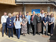 Group of NHS and Somerset Council staff outside Yeovil clinic marking opening of new sexual health service.