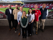 Group of seven partners from RWK Goodman, NatWest, Bishop Fleming, Cazenove Capital and Tech South West at Bristol City stadium.