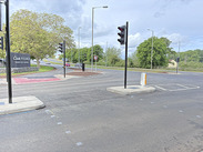 New traffic signals installed at road junction near Clarks Village improve safety and traffic flow with upgraded crossings and signage.