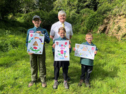 Young Scouts display handmade posters promoting responsible dog ownership and tackling dog fouling at Ham Hill with Cllr Graham Oakes.