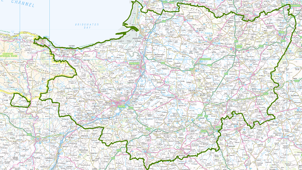 Map of Somerset with green Somerset boundary line, showing major roads, towns and Bridgwater Bay coastline.