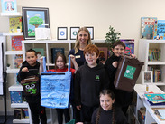 Teacher and five pupils at Priddy and St Lawrence School with recycling containers during a Schools Against Waste visit.