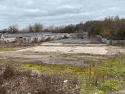 The disused Saxonvale site in Frome, showing derelict warehouses, graffiti, and overgrown vegetation ahead of redevelopment.