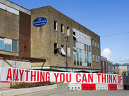 Former Glovers Walk shopping centre building with Yeovil Reimagine artwork hoarding in the town centre, by Yeovil Reimagine.