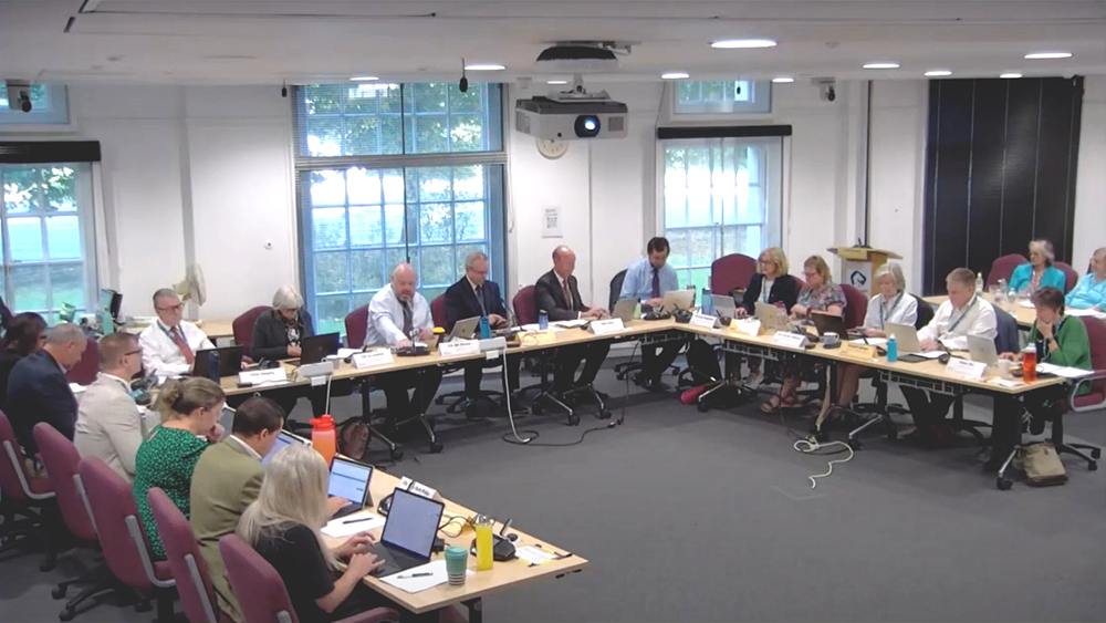 Webcast frame grab showing Somerset Council Executive Members seated around tables during an Executive Meeting in a council chamber.