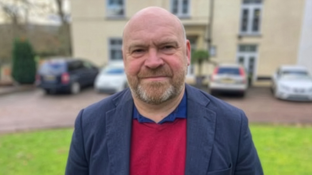 Leader of Somerset Council, Cllr Bill Revans, standing in front of County Hall, Taunton.
