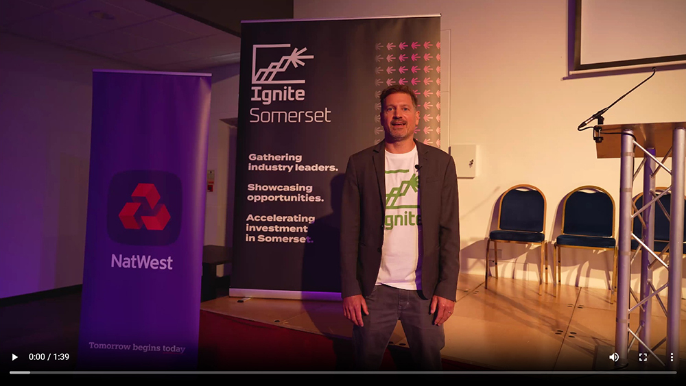 Ignite Somerset Conference Video Thumbnail featuring Harry Singer on stage beside Ignite Somerset and NatWest banners. 