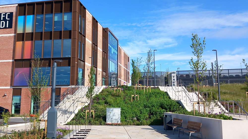 Firepool site in Taunton with the FCDI building, landscaped steps and public realm improvements beside development land.