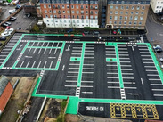 An aerial view of the upgraded Crescent Car Park, showing clearly marked bays, EV charging spaces and new surfacing.