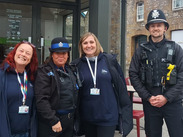 Youth Hub staff and AS Police officers standing in a row outside a youth hub in Taunton.