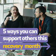 Two people chatting in a support setting with text promoting Recovery Month and ways to help others, courtesy of Turning Point.