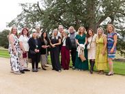Group photo of charity representatives and supporters gathered outdoors at a Somerset garden party celebration.