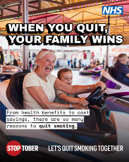 Stoptober campaign poster showing an adult and child enjoying a fairground ride, promoting quitting smoking for family wellbeing.