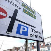 A road sign pointing to the 'town centre'