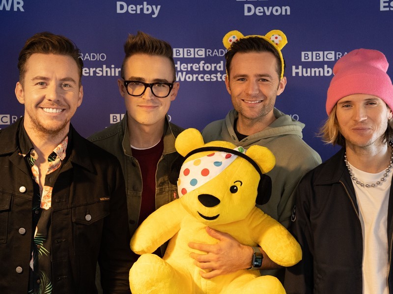 Mcfly band members with Pudsey the Bear