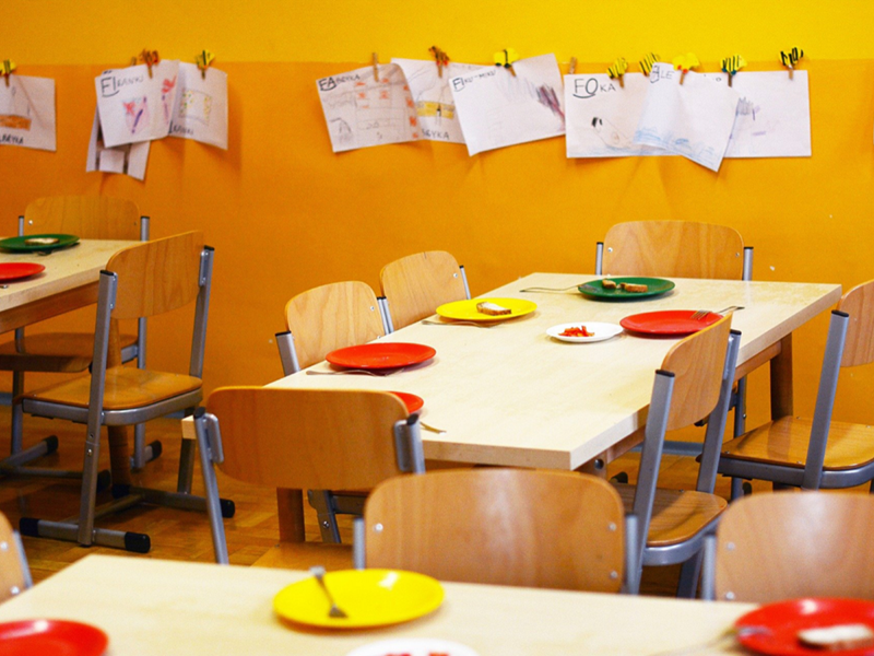 classroom with tables with healthy food on them