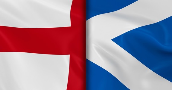 A close up of part of the England and Scotland flags each taking half the image
