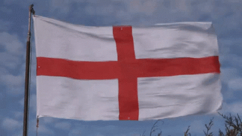 Animated gif - England flag blowing in breeze against a blue sky