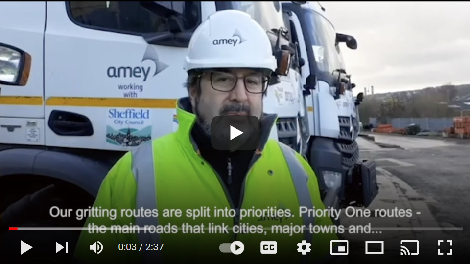 Video still - man looking at camera to talk about gritting
