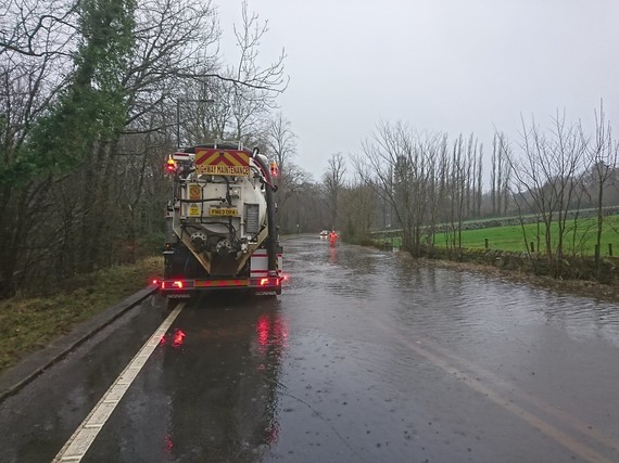 Maintenance lorry on flooded road