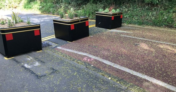 Planted flower boxes across a road to block access