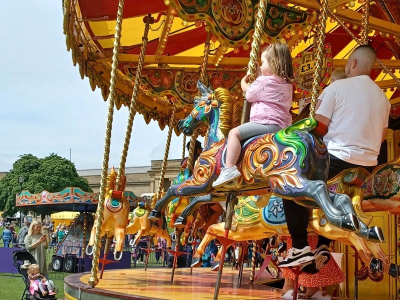 Children having fun on a carousel