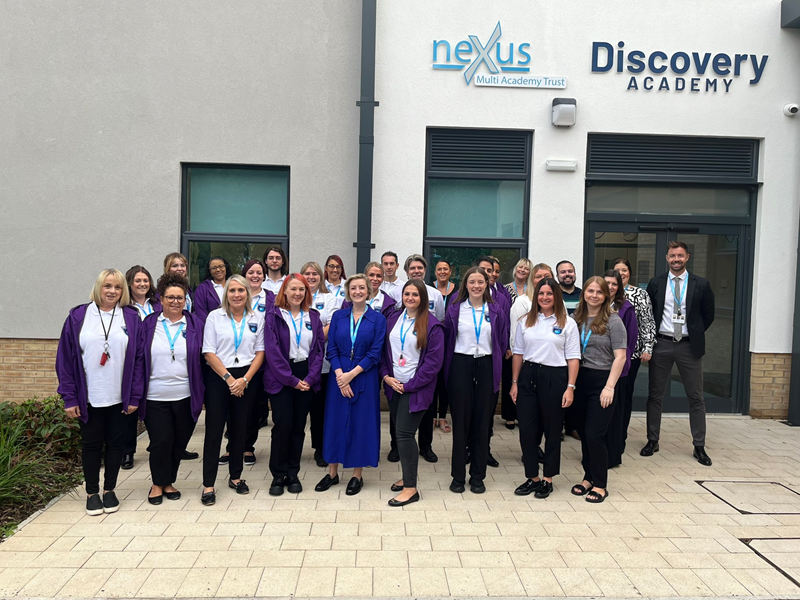 Opening day with staff at the entrance to the academy