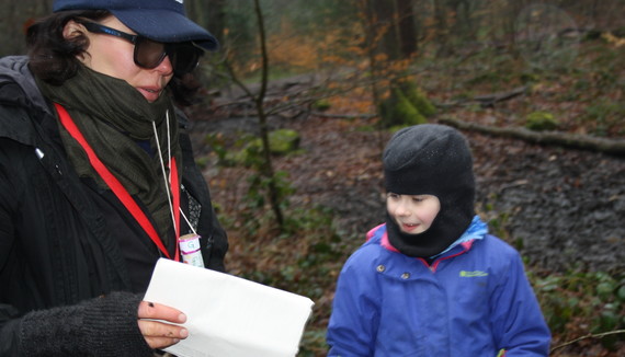 Character and a child taking part in Spy Kids activity