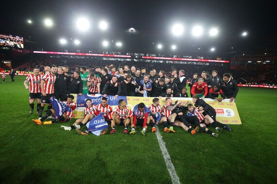 Sheffield United on the pitch celebrating their success