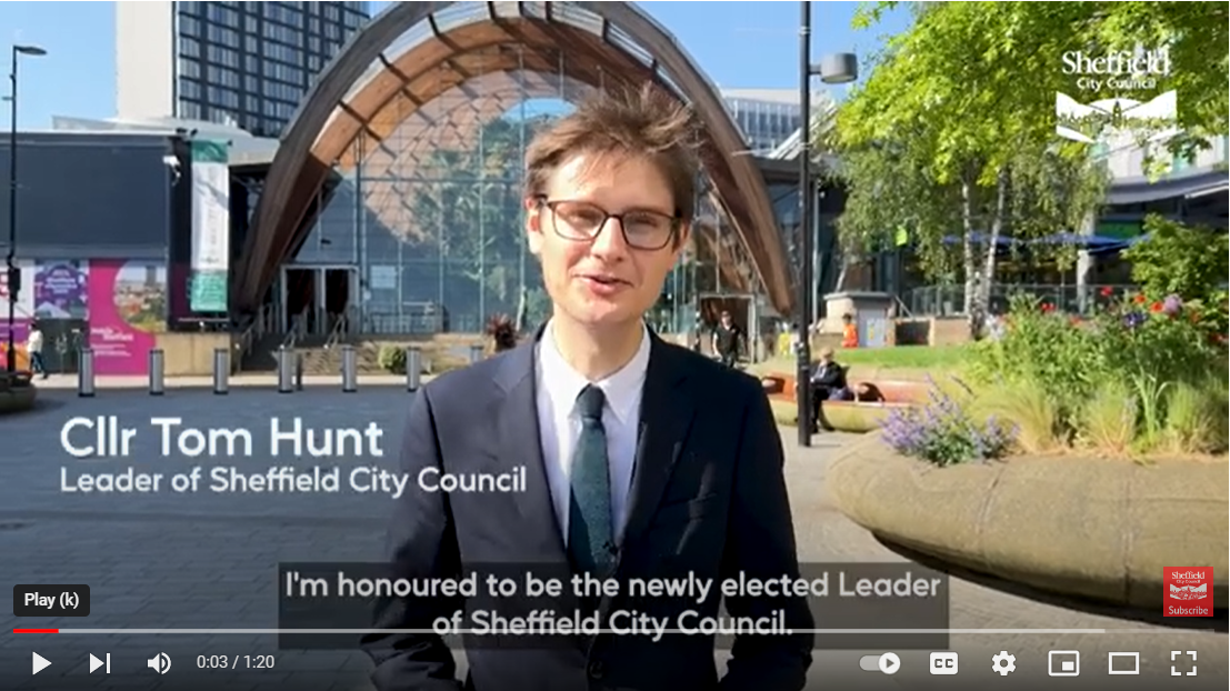 Video frame still showing Council Leader Tom Hunt standing in front of Sheffield's Winter Garden talking direct to camera