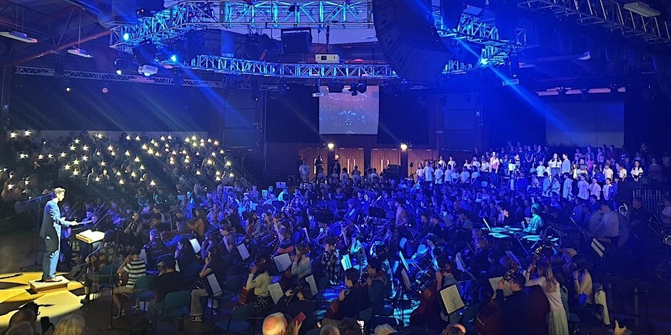 Sheffield Music Hub playing in a room lit up in blue