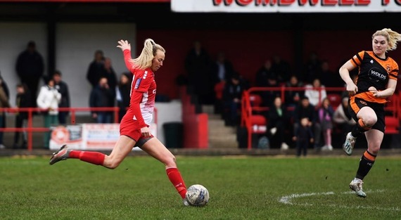 Barnsley Women's Football Club player kicking the ball