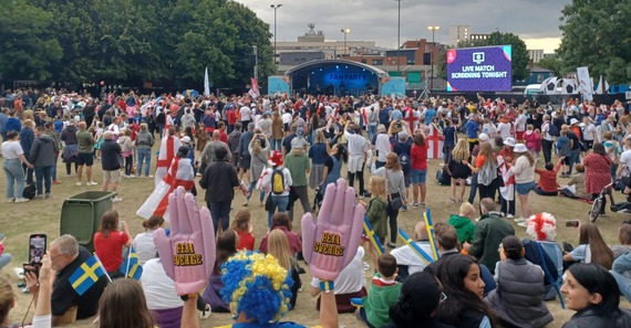 Football fans on Devonshire Green getting ready to watch England versus Sweden at the Women's EURO 2022 Semi-Final on a big screen